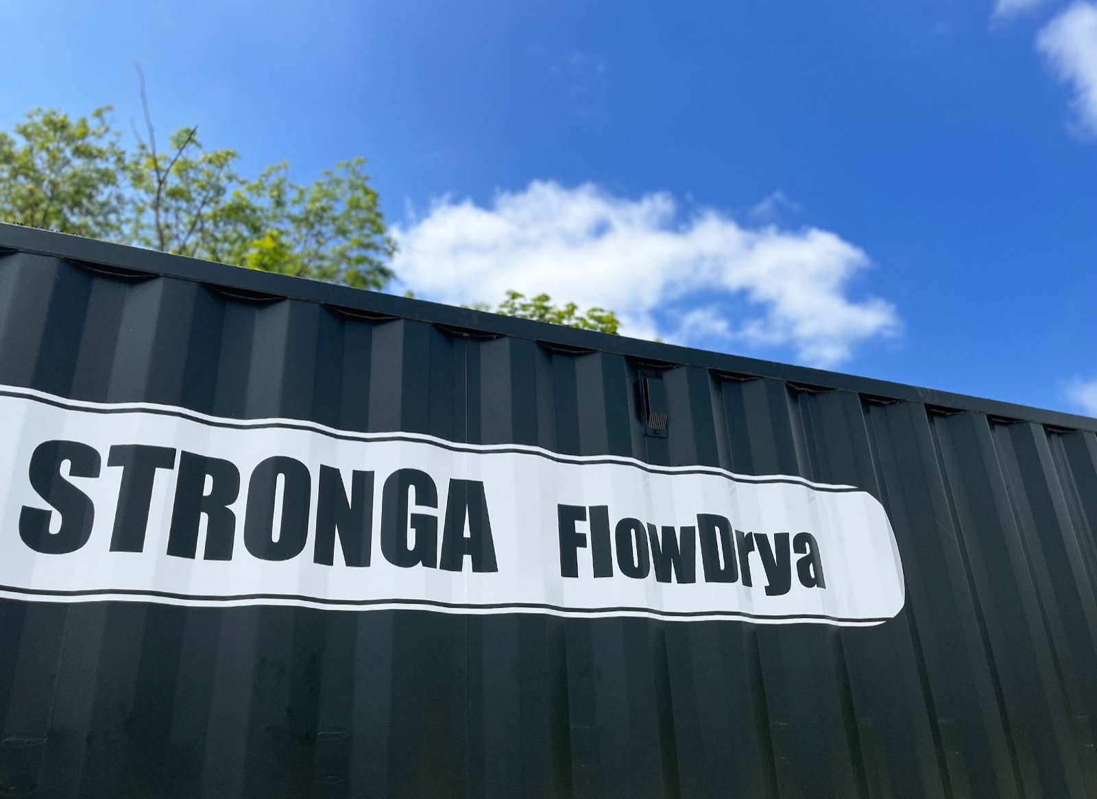 STRONGA FlowDrya MSW trommel fines dryer container against a blue sky