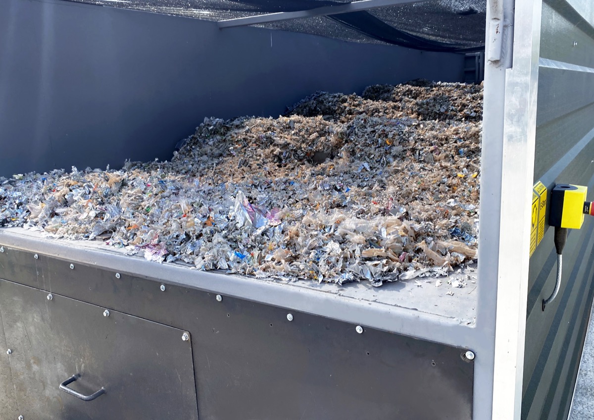 PulseWave agitation of shredded flexible packaging on the FlowDrya drying bed